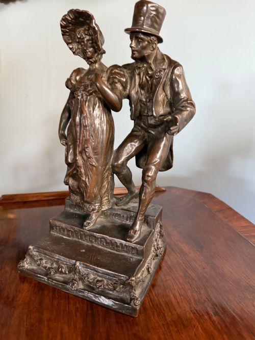 THIS LATE 19TH C EARLY 20TH C BRONZE OFF A DICKENSIAN SCENE