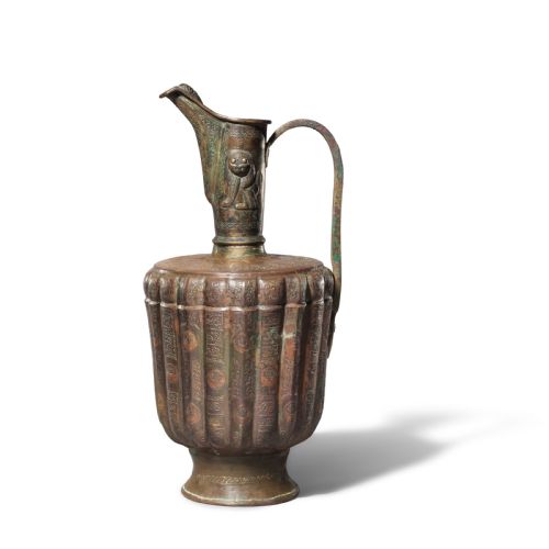 A KHORASAN SILVER AND COPPER INLAID BRONZE EWER PERSIA 12TH CENTURY