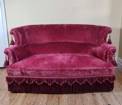 AN ANTIQUE FRENCH SOFA WITH RASPBERRY PINK VELVET UPHOLSTERY