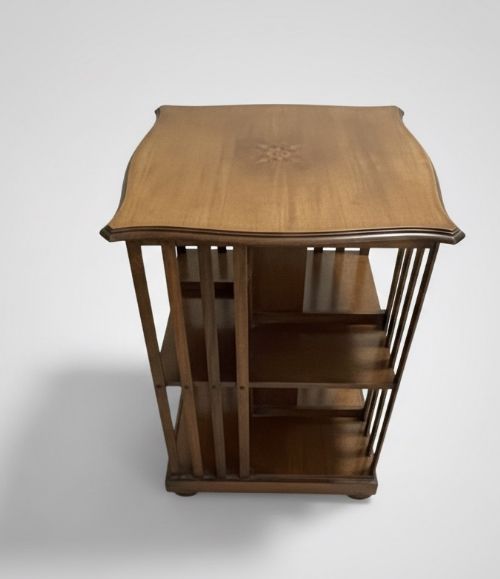 EDWARDIAN SERPENTINE MAHOGANY AND MARQUETRY INLAID REVOLVING BOOKCASE