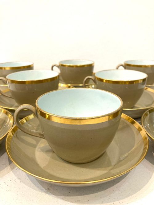 EIGHT 1820'S WEDGWOOD DRABWARE CUPS AND SAUCERS